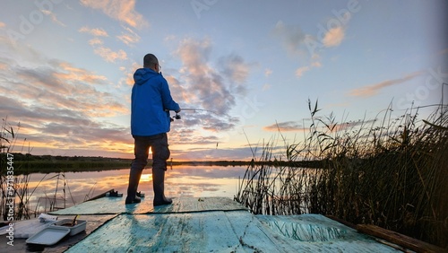 Obraz na płótnie fisherman fishing on shore of Corrib river, Galway, Ireland, spinning, fly fishing, outdoor activities w salonie