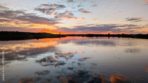 Obraz na płótnie Beautiful sunset landscaper scenery, sky reflected in Corrib river at Galway, Ireland, nature background, wallpaper w salonie