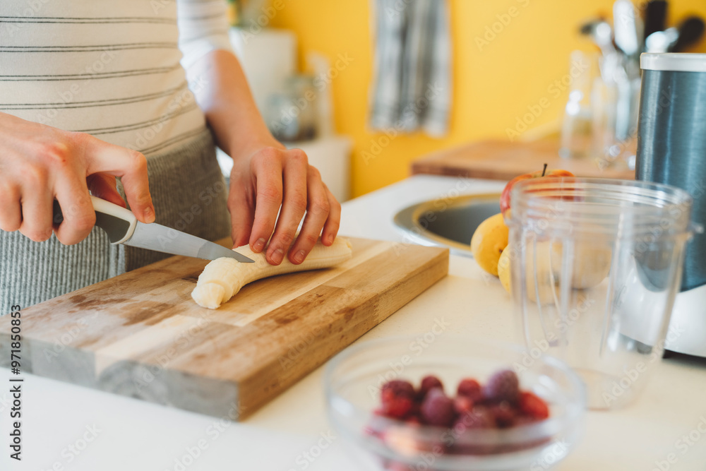 Woman preparing breakfast smoothie Woman preparing breakfast smoothie