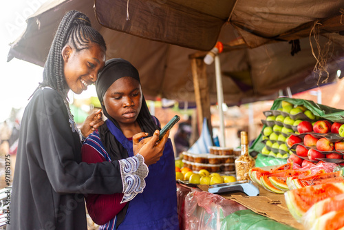 An Exited African female shopping offline at a local fruit market. 