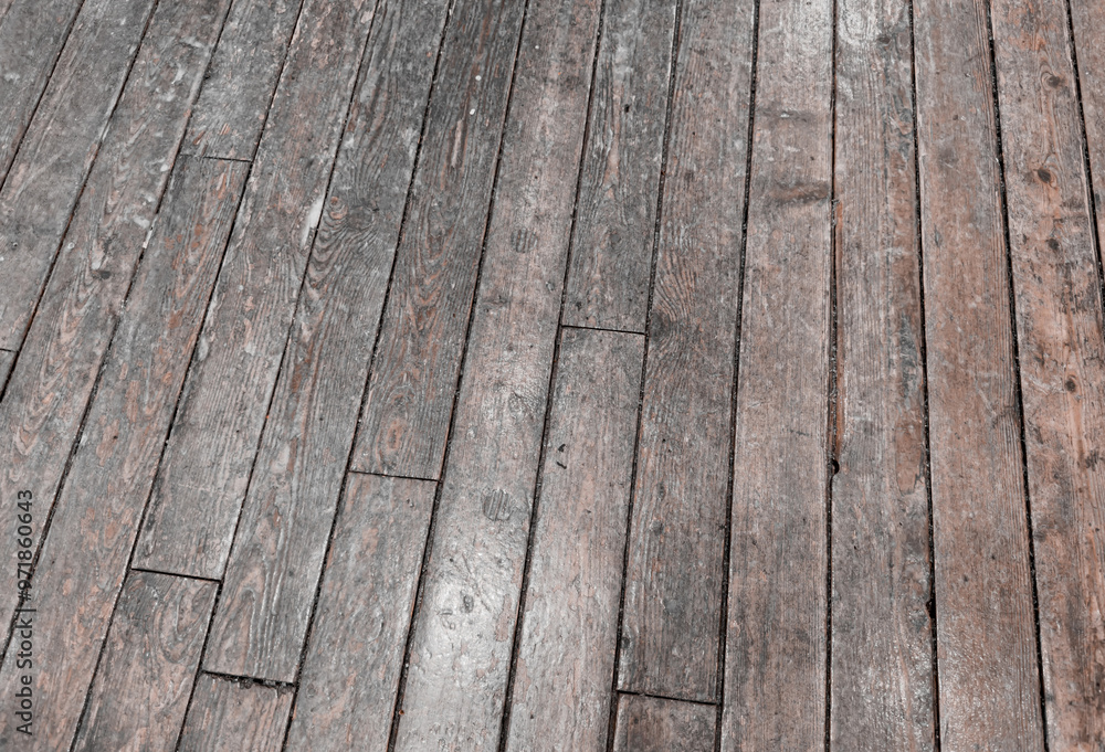 Background image of a floor made of old, wooden boards with traces of life. Background image of a floor made of old, wooden boards with traces of life.