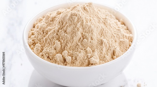 Bowl of Brown Powder on White Background