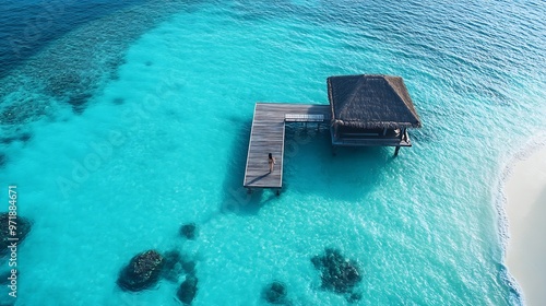 Aerial view of luxury resort on Ismehela Hera with turquoise waters and woman on jetty Addu Atoll Maldives : Generative AI