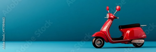 A red scooter is parked on a blue background, symbolizing freedom, adventure, travel, and a carefree lifestyle.