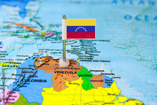 Venezuela flag pin on a map of South America. Conceptual image