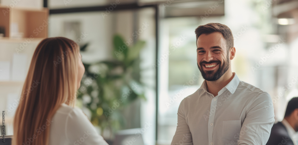 Business professionals meet for the first time at a conference, exchanging smiles and handshakes as they introduce themselves. The environment is welcoming and conducive to networking. Business professionals meet for the first time at a conference, exchanging smiles and handshakes as they introduce themselves. The environment is welcoming and conducive to networking.