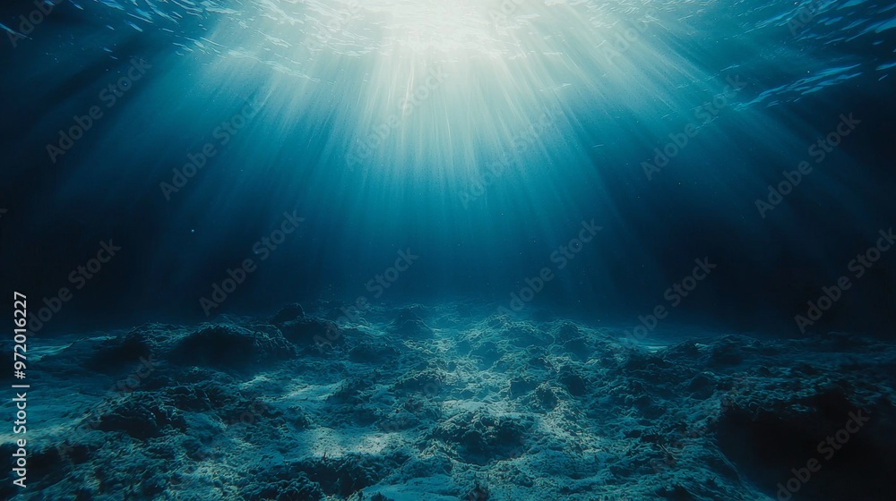 Fototapeta premium Underwater Light Rays Shining Through Deep Blue Ocean