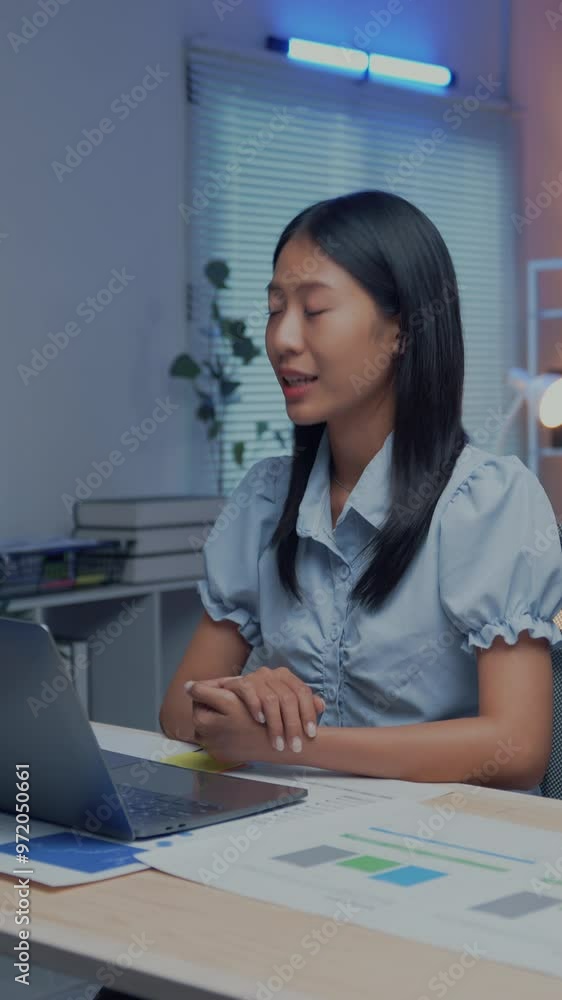 Professional woman conducting an online business meeting. Office setting with digital charts on desk and laptop open on a video call platform Professional woman conducting an online business meeting. Office setting with digital charts on desk and laptop open on a video call platform