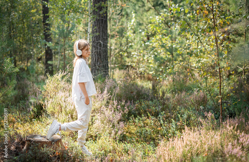 A teenage girl who breathes fresh air and relieves stress in the forest.