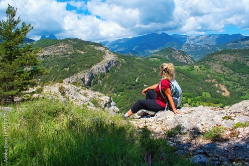 Woman hiker watching beautiful scenery of Spanish Perenees