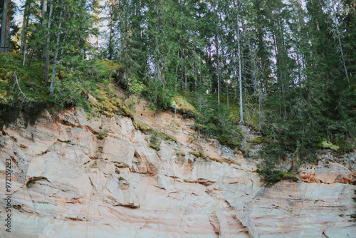 Beautiful sandstone cliffs and caves in Southern Estonia, Taevaskoda nature trail on a summer day photo