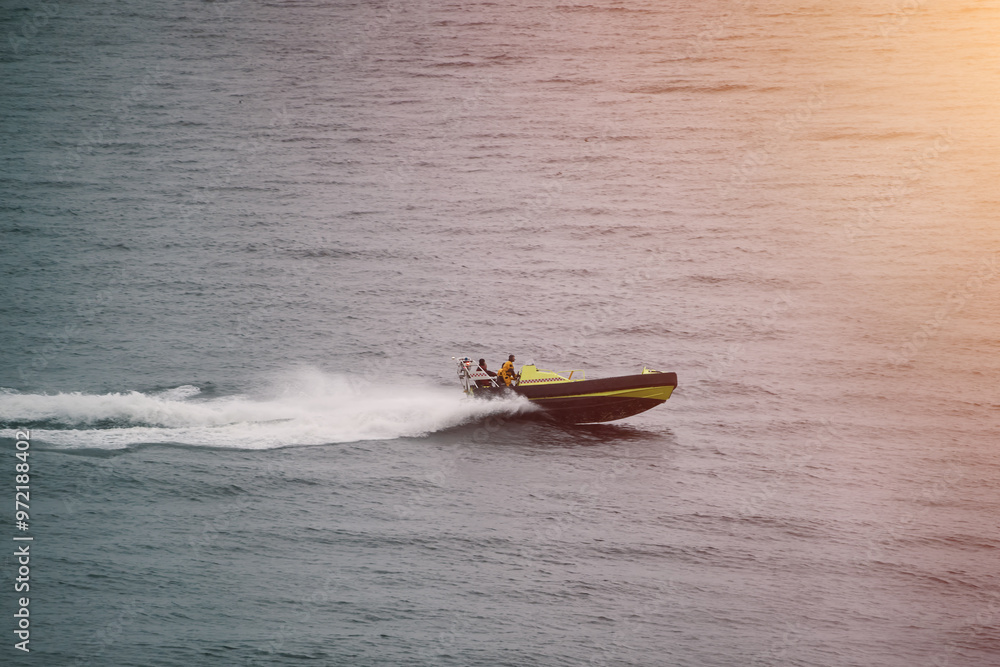 Fototapeta premium Patrol boat slicing through rough ocean waves