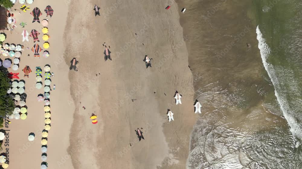 Aerial view of locals preparing kites for kite festival on Kuta Beach in Bali, Indonesia Aerial view of locals preparing kites for kite festival on Kuta Beach in Bali, Indonesia