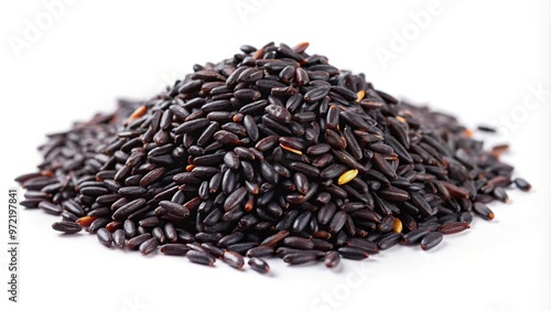 Black rice grains on white surface