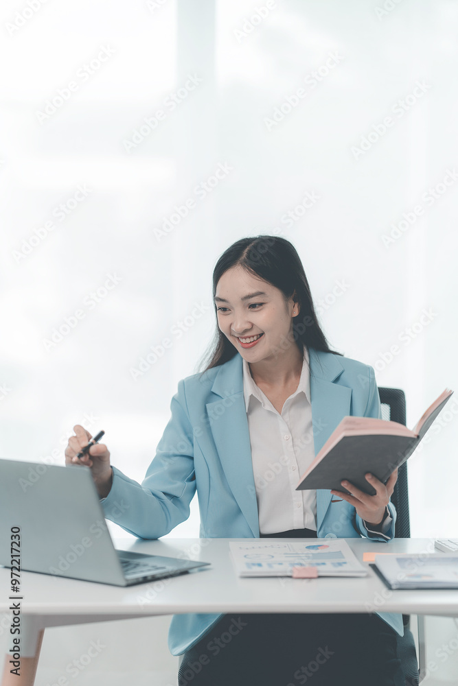 Financial professionals and analysts work with documents and calculators to calculate financial reports in their home offices. Financial professionals and analysts work with documents and calculators to calculate financial reports in their home offices.