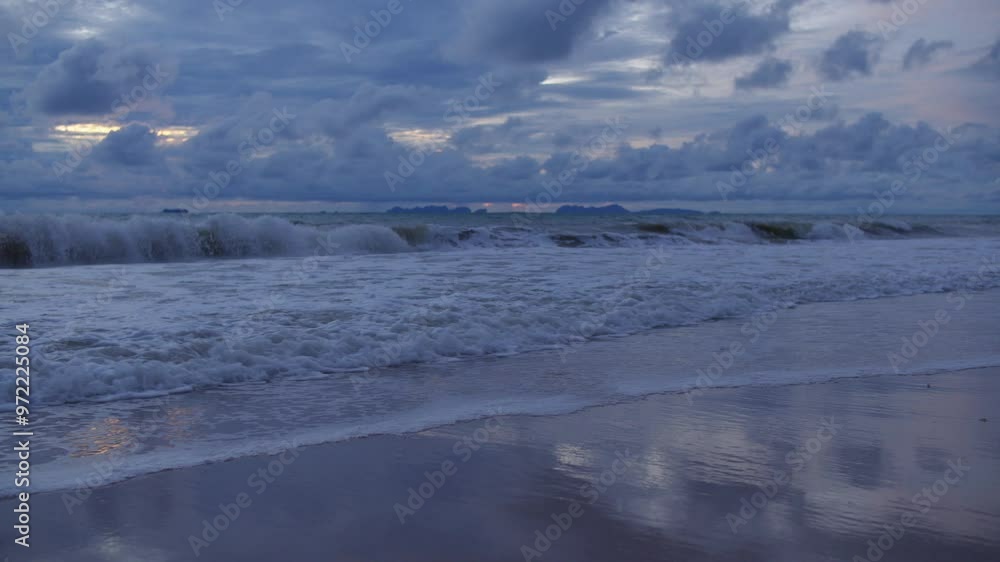 Nighttime view of the beach with the sea, sand, and sky under starry night. Nighttime view of the beach with the sea, sand, and sky under starry night.
