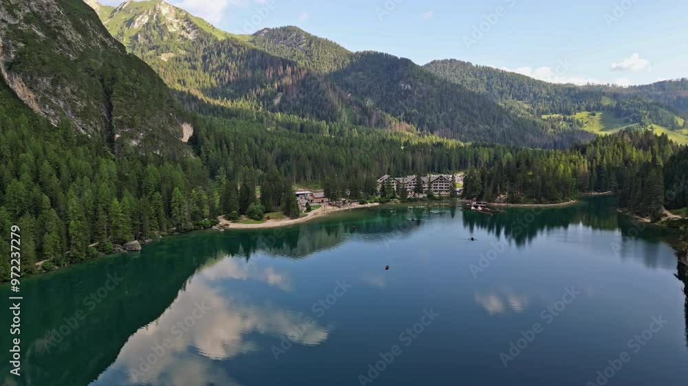 Air view Lago di Braies aerial Italy. Beautiful nature of the Dolomite Alps with ridges and peaks with forests. High quality 4k footage Air view Lago di Braies aerial Italy. Beautiful nature of the Dolomite Alps with ridges and peaks with forests. High quality 4k footage