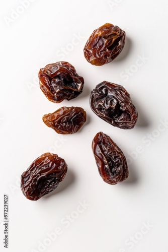 Freshly harvested dates arranged on a clean white surface