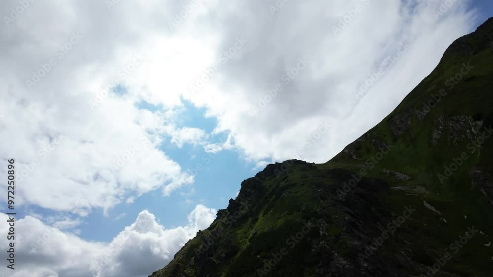 FPV drone flight over mountain peaks of Slovakian High Tatras in cloudy day FPV drone flight over mountain peaks of Slovakian High Tatras in cloudy day