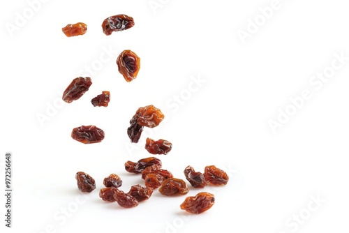 A close-up shot of a pile of raisins on a white surface, perfect for food and dessert images