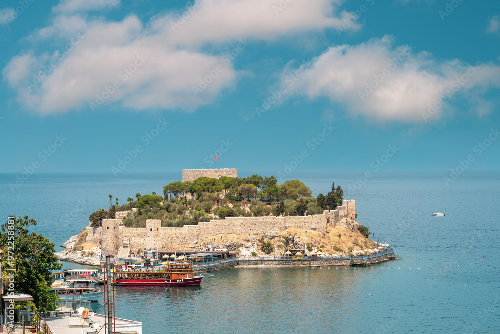 Aerial view of Guvercin Island in Kusadasi Aydin on a sunny day. Turkish name Guvercinada