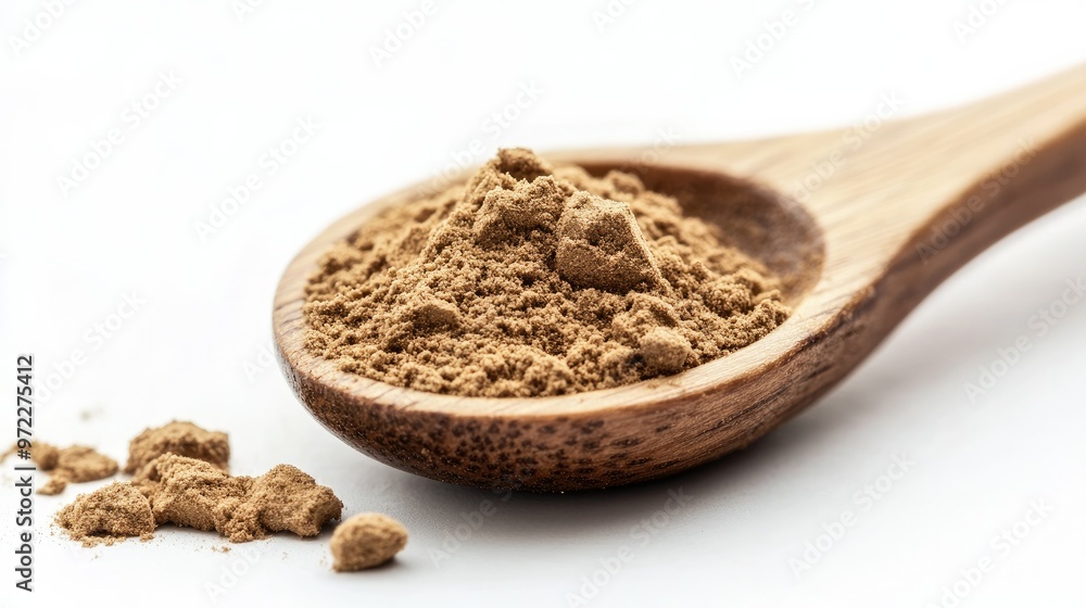 A wooden spoon filled with hojicha powder resting on a white background, showcasing its unique light brown tones A wooden spoon filled with hojicha powder resting on a white background, showcasing its unique light brown tones