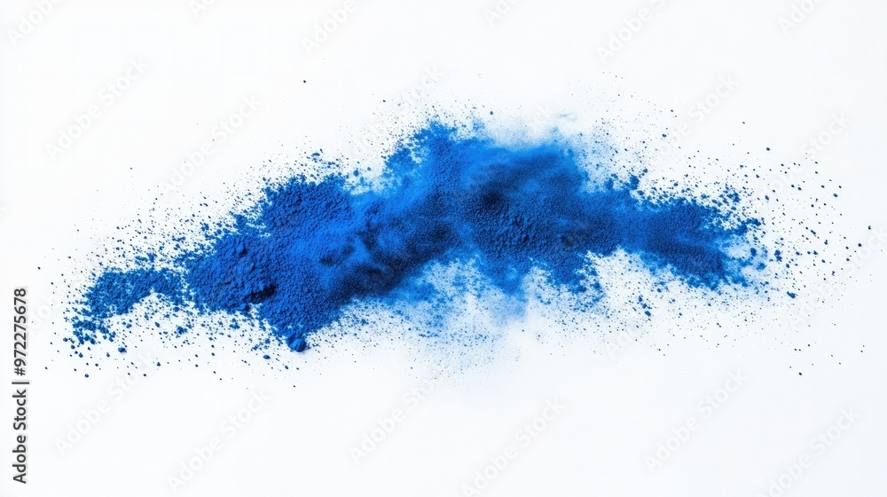 Obraz premium Blue powder spread evenly across a white background, creating a minimalist and eye-catching look for visuals