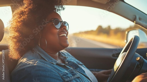 Wallpaper Mural A plus-sized person enjoying a road trip, driving along a scenic route with the windows down and music playing Torontodigital.ca
