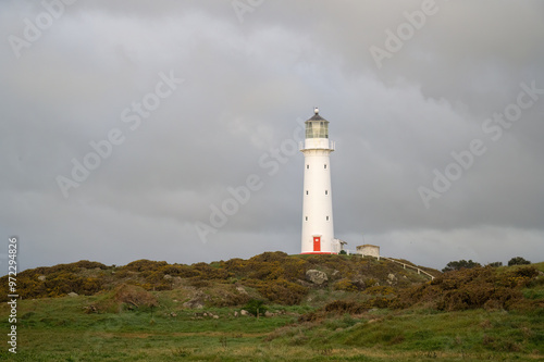 Cape Egmont Lighthouse in Taranaki. Mt Taranaki hidden in the clouds. New Zealand.