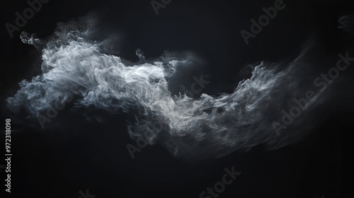 Abstract white smoke or mist flowing on black background.