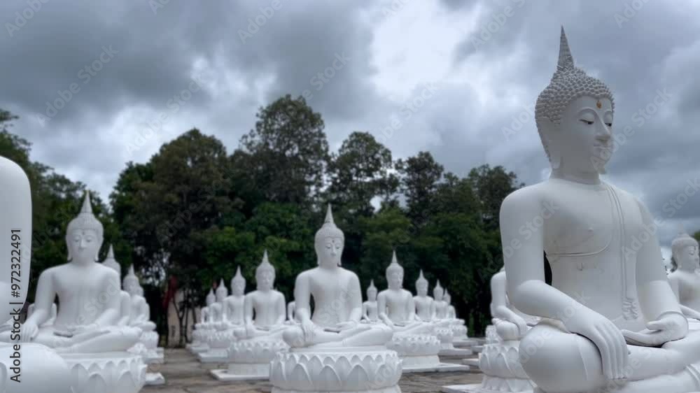 White Buddha Stone statue of a Buddha, Ubon Ratchathani Thailand, Buddha statue is immersed in meditation, Lord Buddha sculpture White Buddha Stone statue of a Buddha, Ubon Ratchathani Thailand, Buddha statue is immersed in meditation, Lord Buddha sculpture