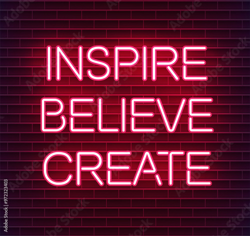 Neon sign reading "Inspire believe create" on a dark brick wall
