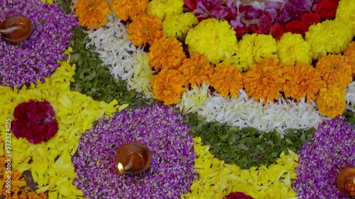 Athapookkalam decorating for onam festival in Kerala ,pookalam decorating Kerala traditional family for onam celebration photo