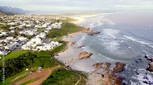 Scenic high angle drone view over sandy coastline of Hermanus beaches photo