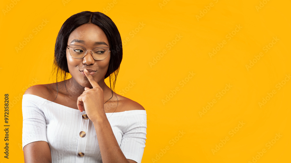 Sly Look. Pretty Afro Girl Thinking About Something Standing Over Orange Studio Background. Panorama, Copy Space Sly Look. Pretty Afro Girl Thinking About Something Standing Over Orange Studio Background. Panorama, Copy Space