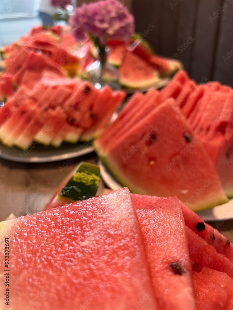 sliced watermelon for a large company close-up in several plates in the rays of the sun authentic lifestyle sliced watermelon for a large company close-up in several plates in the rays of the sun authentic lifestyle