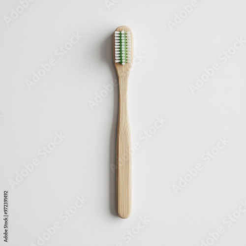 Single bamboo toothbrush is lying on a white background