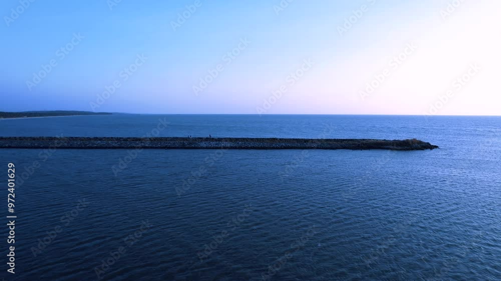 Narrow Breakwater into the Calm Arabian Sea Narrow Breakwater into the Calm Arabian Sea