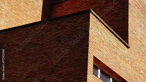corner of an industrial building with a red brick facade