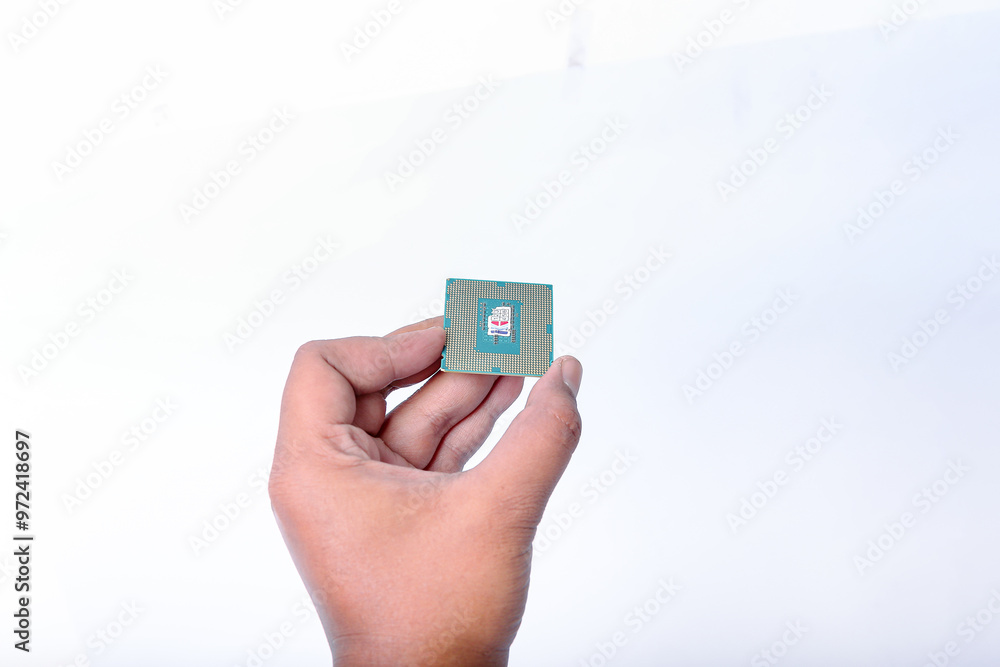 hand holding Processor for PC on a white background. Processor for personal computer closeup isolated on white background. hand holding Processor for PC on a white background. Processor for personal computer closeup isolated on white background.