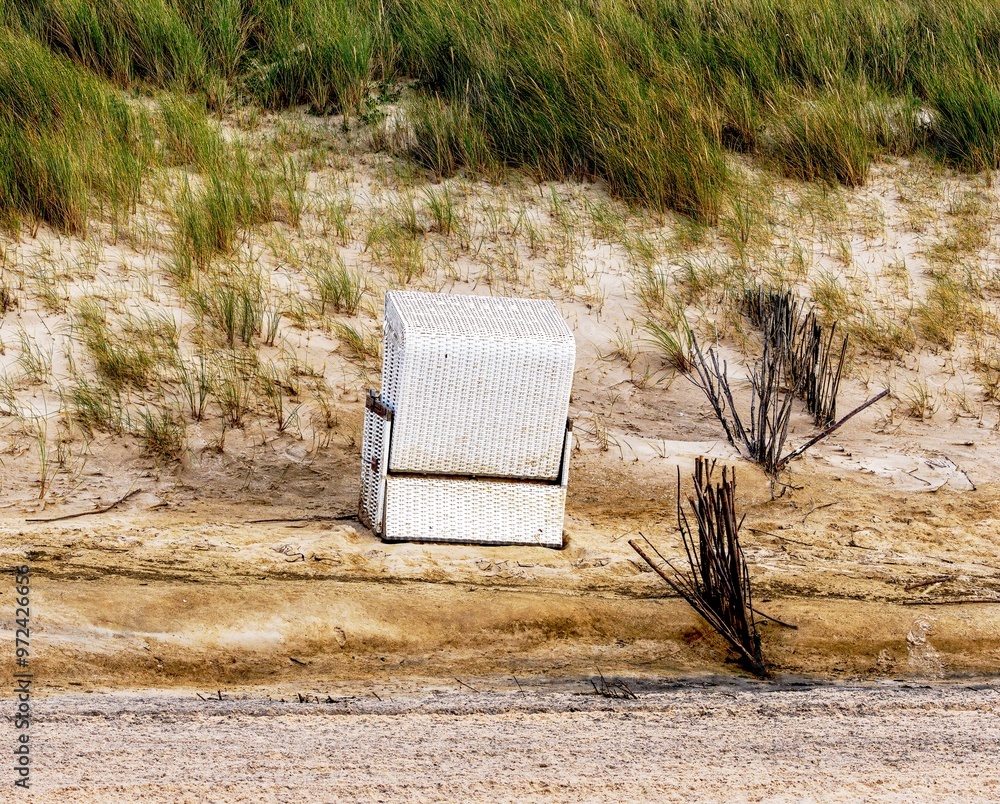Beach chair washed into the dunes by the storm