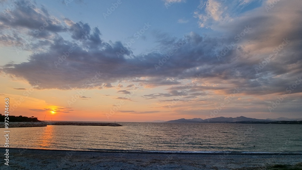 Naklejka premium sunset in monolithi beach preveza city greece longest beach in europe