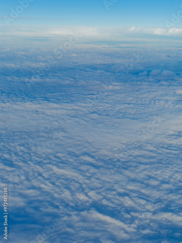 view from airplane window on clouds