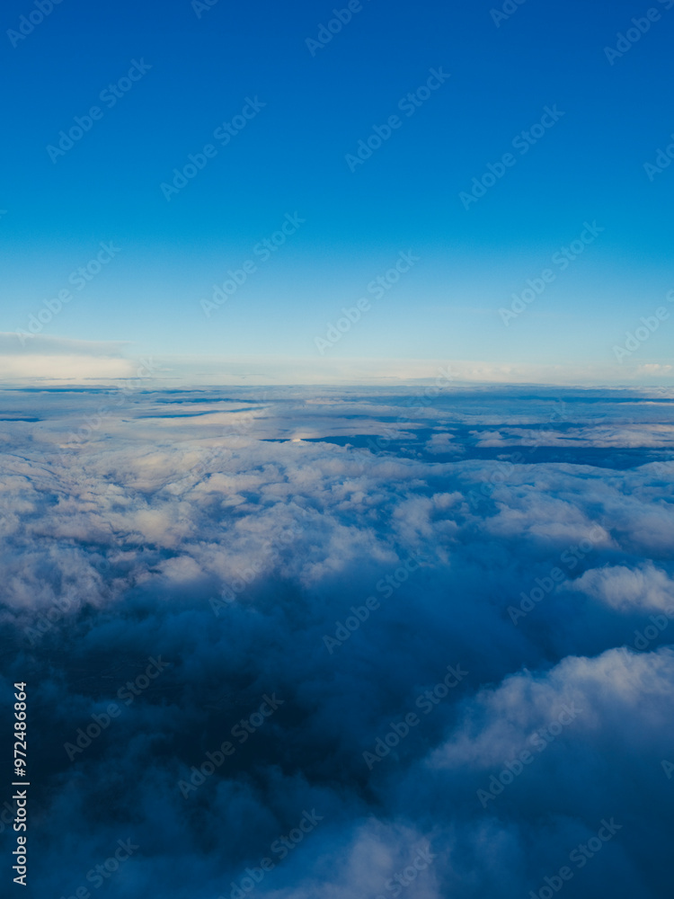 view from airplane window on cloudscape view from airplane window on cloudscape