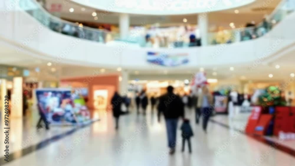 Blurred scene for a background of people walking through a shopping mall. Blurred scene for a background of people walking through a shopping mall.