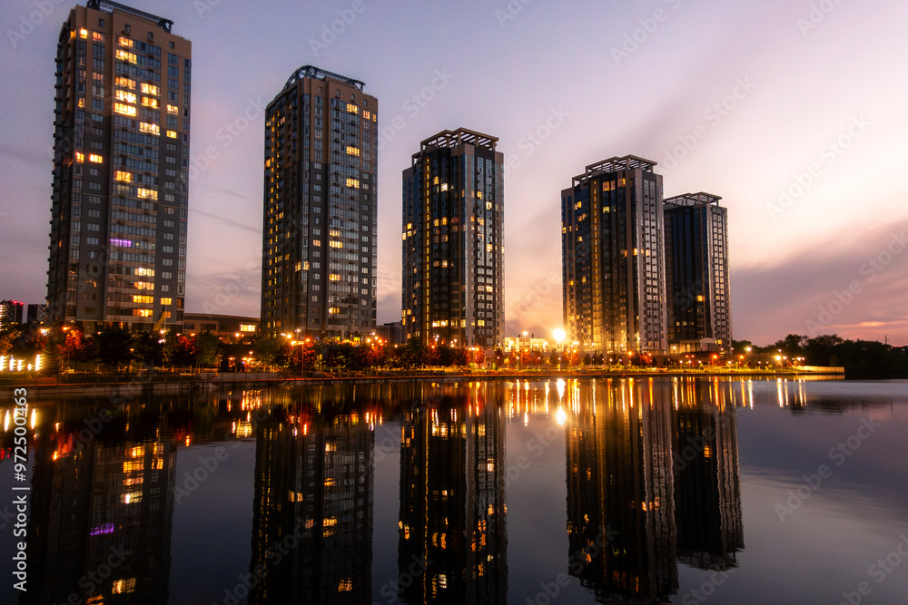 Fototapeta premium Modern Waterfront Buildings at Sunset