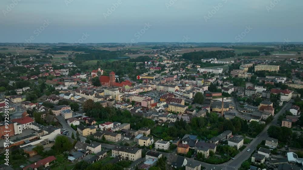 Aerial view of a small town with a prominent church in the center, surrounded by residential buildings and greenery - Lubawa, Poland Aerial view of a small town with a prominent church in the center, surrounded by residential buildings and greenery - Lubawa, Poland