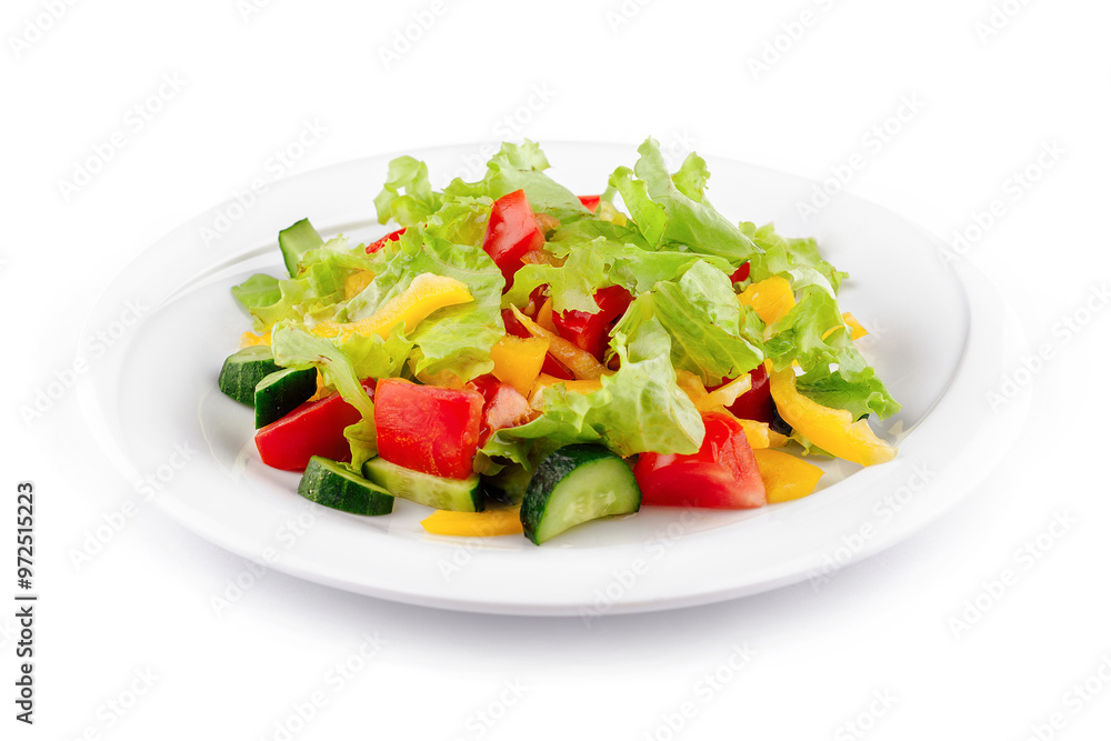 Fresh salad with lettuce, tomatoes, cucumbers and peppers on white plate Fresh salad with lettuce, tomatoes, cucumbers and peppers on white plate