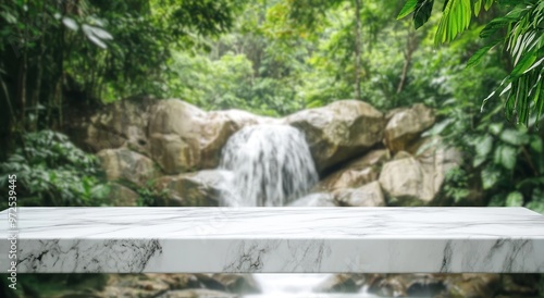 A serene waterfall scene framed by lush greenery, with a marble table in the foreground.