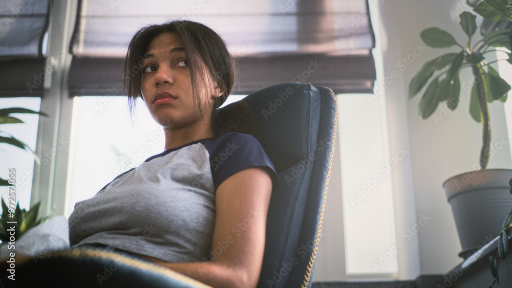 Frustrated African American teenage girl with napkin sits in chair, talks about family problems on therapy session with psychologist. Teenager during consultation in psychological office. Slow Motion. Frustrated African American teenage girl with napkin sits in chair, talks about family problems on therapy session with psychologist. Teenager during consultation in psychological office. Slow Motion.